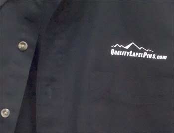 Black shirt with Quality Lapel Pins logo